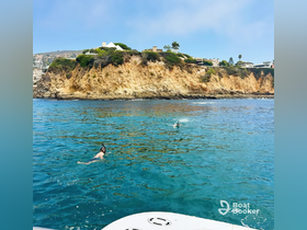 Two snorkelers explore the vibrant waters near a stunning coastline, showcasing the perfect blend of adventure and natural beauty.
