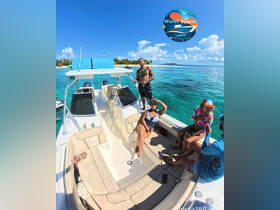 A lively group enjoys a day on the water aboard a boat, showcasing fun and relaxation under the sun — perfect for memorable outings and water adventures.