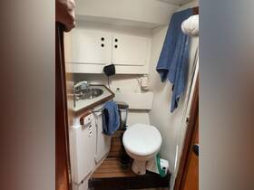 A clean and functional bathroom inside a boat, featuring essential amenities for comfort during voyages.