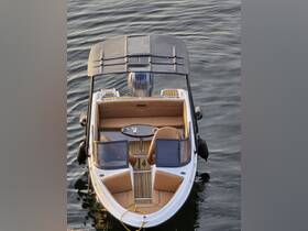 An elegant interior view of a Mirage boat showcasing plush seating and a stylish helm, perfect for comfortable outings on the water.