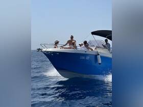 A lively group enjoys a day on the water aboard a boat, capturing the essence of fun and adventure in the sun.