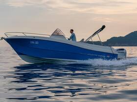 A sleek speedboat glides through calm waters, showcasing its elegant design and powerful performance — perfect for thrilling adventures on the sea.
