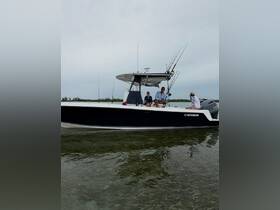 A group enjoys a day of fishing aboard a Contender boat, showcasing camaraderie and adventure on the water.