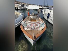 A charming view of a boat docked at the marina, featuring a beautifully decorated deck with cushions, perfect for relaxing on the water.