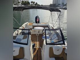 An inviting view of the interior of a Starcraft boat, showcasing the helm and comfortable seating, perfect for a day on the water.