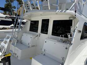 A clean and spacious helm area of a boat, showcasing the console and seating, perfect for navigating the waters in style.