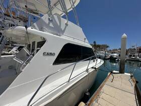 A sleek yacht named 'GARO' docked at the marina, showcasing its elegant design and ready for the next adventure on the water.