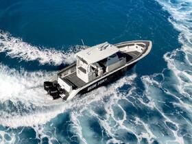 A stunning aerial view of the 'BLUE FURY' speedboat cutting through vibrant blue waters, showcasing its sleek design and powerful performance.