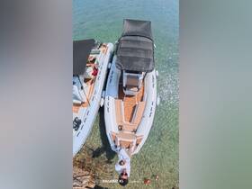 An aerial view of two boats anchored in clear water, with a person enjoying the moment — perfect for showcasing fun on the water.