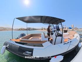A person stands at the helm of a sleek boat docked in clear waters, showcasing a perfect day for boating adventures under the sun.