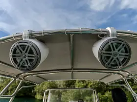 Close-up view of high-quality audio speakers mounted on a boat, perfect for enhancing your on-water entertainment experience.
