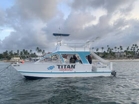 The 'TITAN Boat Party' is docked, showcasing its unique design and features, perfect for group celebrations on the water.