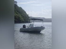 A sleek speedboat anchored in calm waters, surrounded by lush greenery — perfect for fishing trips or leisurely outings.