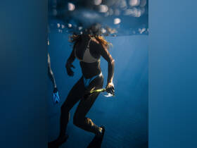 A snorkeler explores the vibrant underwater world, showcasing the thrill of marine adventures and the beauty of ocean life.
