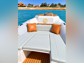 A stylish interior view of a boat's seating area, featuring plush cushions and elegant design, perfect for relaxing on the water.
