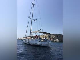 A beautiful sailboat named Panagia anchored in calm waters, showcasing its elegant design against a clear blue sky.