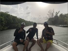 A group of friends enjoys a fun moment on a boat, showcasing camaraderie and the joy of boating adventures.