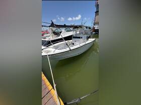 A sleek center console boat docked at the marina, showcasing its clean lines and inviting design — perfect for fishing or day trips on the water.