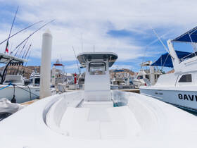A clean and spacious interior view of a boat's helm and seating area, perfect for comfortable cruising and fishing adventures.