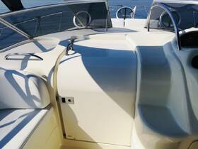 A clean and modern helm area inside a boat, showcasing the sleek design and functionality of the cabin space, perfect for navigation and comfort on the water.