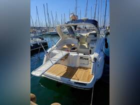 A sleek yacht named 'Mirea' docked at a marina, showcasing its elegant design and spacious deck, perfect for leisurely outings on the water.