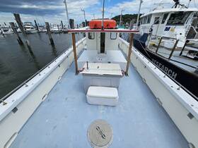 Interior view of a boat's helm area, showcasing the seating and layout, ideal for fishing or cruising adventures.