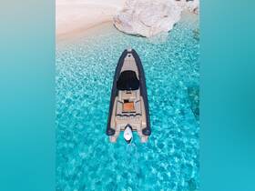 A stunning aerial view of a sleek boat anchored in crystal-clear waters, perfect for exploring beautiful coastal destinations.