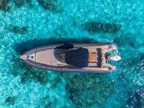 A stunning aerial view of a sleek speedboat gliding over crystal-clear turquoise waters, showcasing the beauty of aquatic adventures.