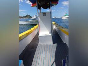 Interior view of a boat's helm area, showcasing the seating and layout, ideal for navigating the waters comfortably.