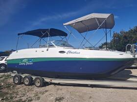 A sleek luxury charter boat named 'Christina' is docked and ready for adventure, showcasing its stylish design and spacious layout.