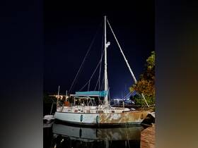 A beautifully lit yacht docked at night, reflecting on calm waters — perfect for evening cruises or romantic getaways.
