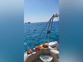 A selection of fresh fruits arranged on a boat, perfect for enjoying snacks while cruising on the water. Ideal for a relaxing day at sea.