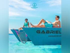 Two friends enjoy a sunny day on the bow of a boat, soaking up the sun and relaxing in the beautiful turquoise waters — a perfect scene for summer adventures.