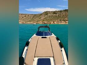 A stunning view of a boat anchored in crystal-clear turquoise waters, surrounded by scenic cliffs — perfect for a relaxing day on the water.