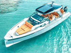 A stunning aerial view of a sleek yacht anchored in crystal-clear waters, showcasing its elegant design and spacious seating area, perfect for luxurious outings.