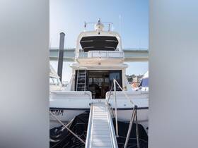 A clear view of a yacht's rear exterior, showcasing its structure and design while docked, perfect for luxury boating enthusiasts.