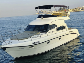 A stunning yacht cruising through calm waters, showcasing its elegant design and spacious deck, perfect for luxury outings on the sea.