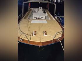 A clear view of the front deck of a boat, showcasing its structure and design, perfect for evening outings on the water.