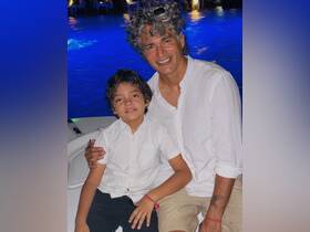 A joyful moment captured between a father and son, showcasing their bond during a memorable boating experience — perfect for family outings.