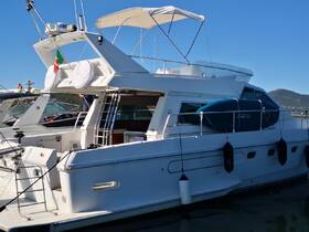 A sleek yacht docked at the marina, showcasing its elegant design and features, perfect for luxury boating experiences.