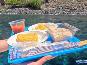 A colorful tray of snacks and drinks, perfect for enjoying on the water — ideal for boat trips and picnics.