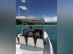 Interior view of a well-equipped boat helm with comfortable seating, perfect for navigating the beautiful waters.