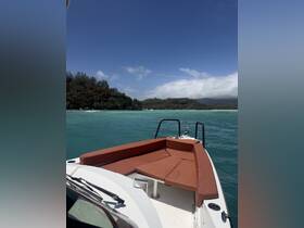 A scenic view from the front of a speedboat, showcasing the lush greenery and turquoise waters of the surrounding area — perfect for exploring coastal destinations.