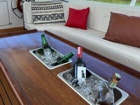 A stylish setup featuring a selection of chilled drinks in an elegant boat interior, perfect for entertaining guests on the water.