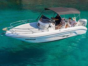 A family enjoys a day on the water aboard a sleek boat, creating lasting memories in the beautiful turquoise sea.