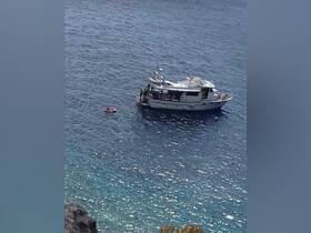 A scenic view of a boat in motion on clear waters, showcasing an enjoyable day on the water.