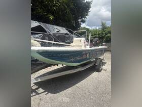 A well-maintained speedboat parked and ready for adventure, showcasing its vibrant design and equipped for fishing trips.