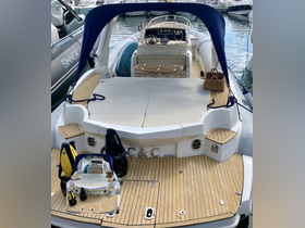 A well-appointed interior view of a boat showcasing comfortable seating and a modern helm, perfect for leisurely outings on the water.