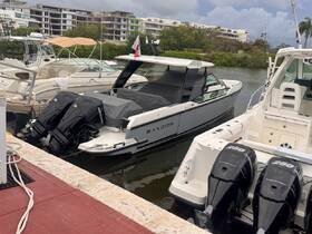 A sleek Saxdor boat docked at a marina, showcasing its modern design and powerful twin engines, perfect for a day on the water.