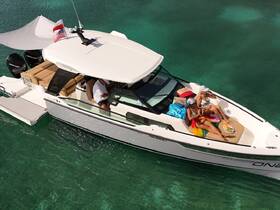 Two friends enjoy a relaxing day on a luxury boat, sunbathing and sipping drinks in crystal-clear waters — the perfect getaway for fun and relaxation.